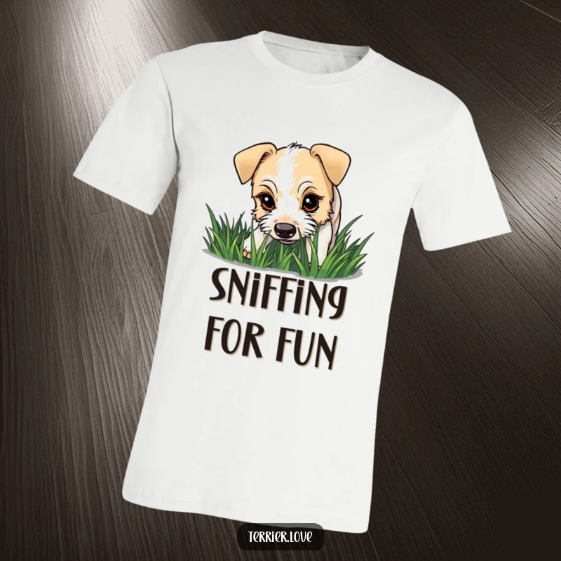 Funny terrier t-shirt depicting a dog with a curious gaze intently sniffing a patch of grass, full of investigative spirit.